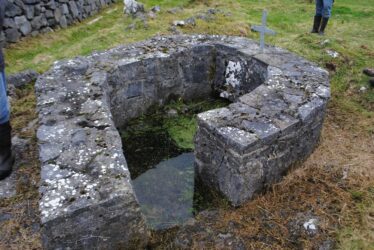 stone wall surrounding water source | Christy Cunniffe