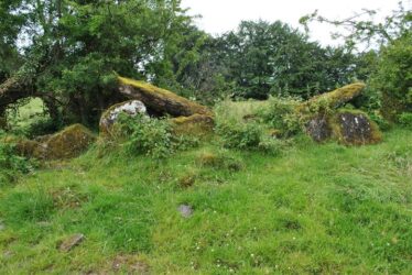 Wedge tomb side view showing the cap stone | Christy Cunniffe
