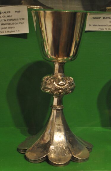 Silver chalice with decorative knop and attractive foliate base. | Christy Cunniffe