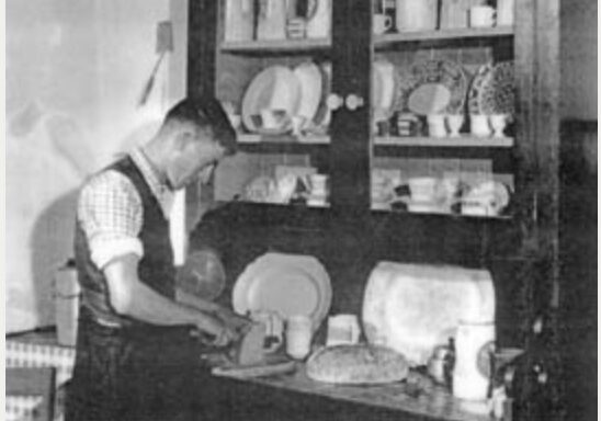 Cutting Bread at the Dresser C1948