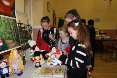 Children casting an envious glance at the knitted dolls during Heritage Exhibition as part of the first celebration of Culture Day on 20th September, 2013 | Photo: Bernadette Connolly, Clogher boy