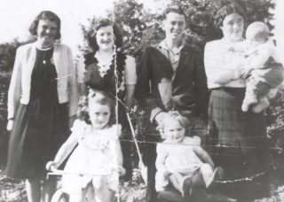 L-r: Kath. Donnellan, Togher; Mary Ryan, Mick Stephens, Togher; Bridgie Farrell, baby Jn. Farrell and Nora and Rose Farrell (all Farrells from Togher).