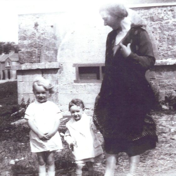 McHugh at Market House Mrs. McHugh with her two children at Market House