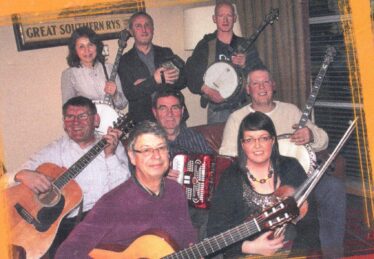 Peter Carey, 2nd row 1st left with members of Tuesday Trad session in Lowry's Clifden | Photo: taken from back of CD in aid of Galway Hospice