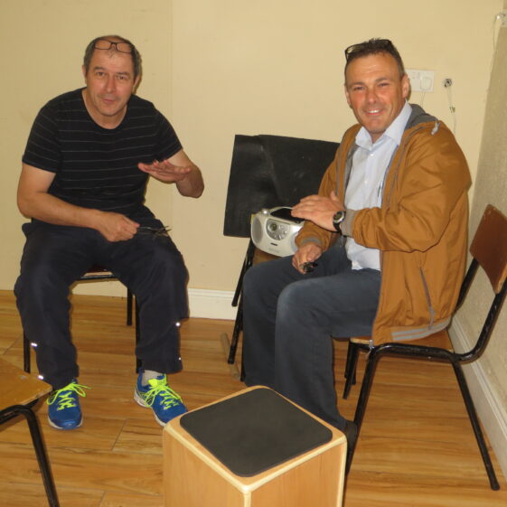 Seamus Morrissey, Barnaderg, learning how to play the spoons from Brendan O'Boyle, Creevaghbaun. | Photo: Bernadette Forde
