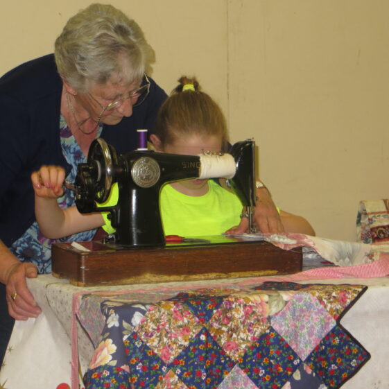 Eileen Reynolds, Cloonlusk, teaching Sarah Ahern Togher, how to do patchwork | Photo: Bernadette Forde