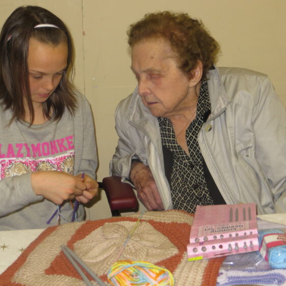 Rebecca learns to knit taught by Mary Nolan | Photo: Bernadette Forde