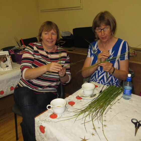 Mary and Brid learning how to make St. Brigid's crosses, during our Bealtaine Festival in Barnaderg Community Centre. | Photo Bernadette Forde
