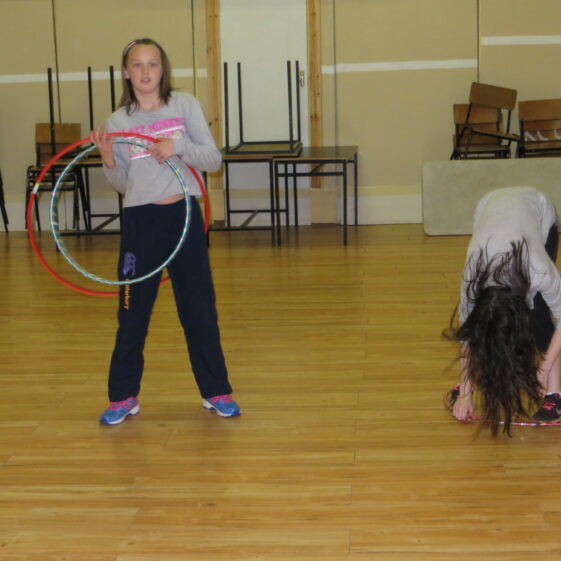 Rebecca and Alina Rooney ltrying to master the hoola hoop in Barnaderg Community Centre, during Bealtaine Festival | Photo: Bernadette Forde