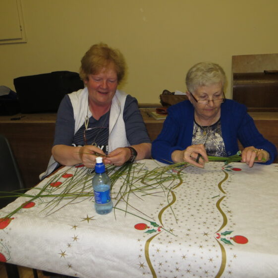 Mary P. Mullins, Dangan, learning how to make St. Brigid's crosses from Mary Ellen Burke, Gurranecoyle | Photo: Bernadette Forde
