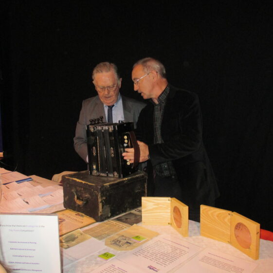 Frank Glynn & Christy Cunniffe with PJ Conlon's musical instrument