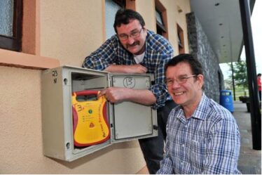 Help is only minutes away: Chairman of the Milltown AED group Padraig Coyne and Secretary Charles Carne | Photo by Ray Ryan