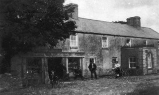 Today it's Ruanes Pub. When this photograph was taken it was The Central House or The Stage Coace Inn. At this tiome the name above the door was P Lyons