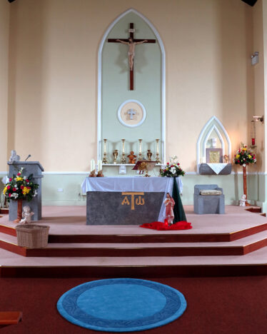 Final resting place of Fr Joseph Judge in front of the altar in Menlough Church | © Gerry Costello Photography