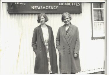 May Cregg and a friend outside her café at Woodlawn Station, c. 1930