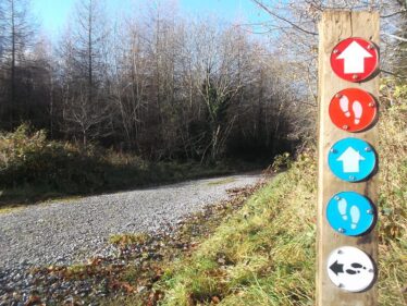 Sign showing various tracks and trails in Woodlawn