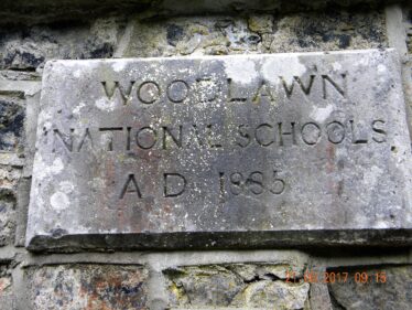 The old national school plaque depicts the school was opened in 1885.