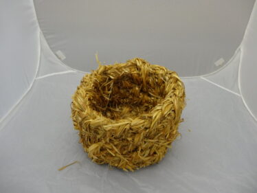 A modern, straw-made copy of an egg basket.  | MHG