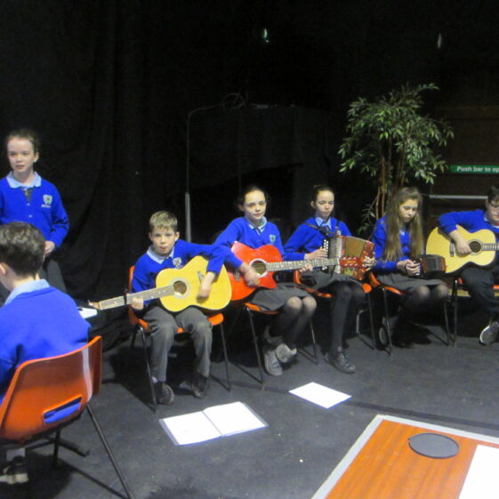 Kid playing music at launch | Photo: Frank Glynn