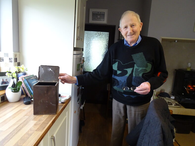 Micheal McHugh with the biscuit tin in which the letters were stored | Photo: Pauline Connolly 2023