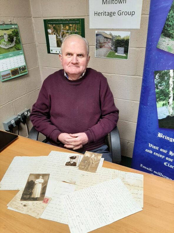 Liam Delaney presents Milltown Heritage Group with his collection of family letters and picture postcards