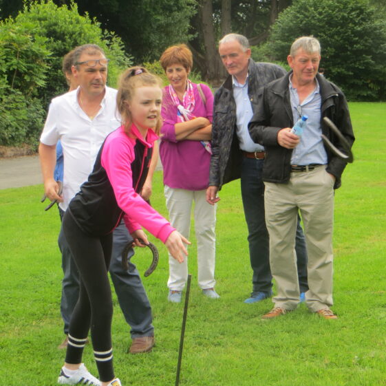 Aoife-having-a-go Aoife Butler having a go at the horse-shoe throwing closely watched by Brendan O'Boyle, Bridie and Miko Keane and Michael Treacy | Photo: B. Forde