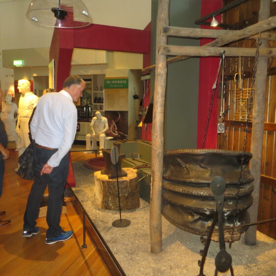 Miko-and-Mattie-Cunningham-with-Bellows Miko Keane and Mattie Cunningham admiring the tools of the forge including the big bellows in the forefront. | Photo: B. Forde
