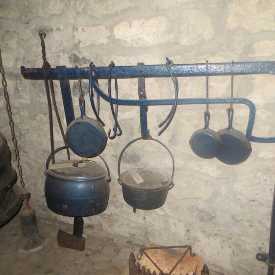 fire-crane-and-implements Fire crane with cooking implements used in a bygone era | Bernadette Forde