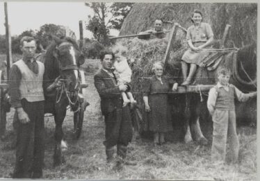 L-r: Ned Mullen, John Maloney (his nephew), Baby John Maloney, Ban Hughes, Daisy Hughes and visitors home for the summer.  Photo taken in 1930s | Photo: Out and About 2004 P. 88