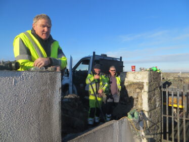 Co. Council workers who put up the sign | Photo: Bernadette Forde