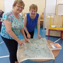 Ber and Eileen examining an old Map of the area Bernadette Forde and Eileen O'Connell examining an old map of the area loaned to us by Martin Curley