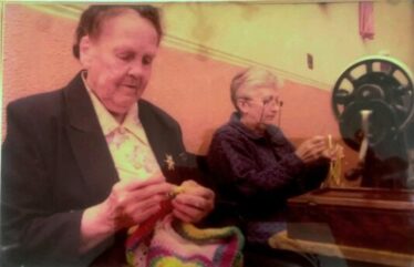 Mary Dolan, Peak displaying her skill with crochet needle and on right Mary E. Burke making St. Brigid's crosses | Photo: Bernadette Forde