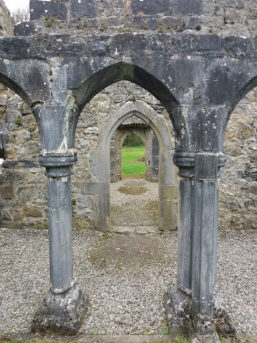 Looking through arch to another arched doorway which leads to another doorway, Portumna