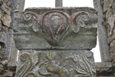 Decorative element on the top section of the tomb. | Christy Cunniffe