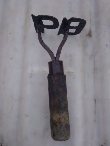 Burke branding iron with wooden handle.  | PJ Burke
