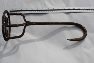Side view of the branding iron showing the curved tail to the handle.  | Christy Cunniffe
