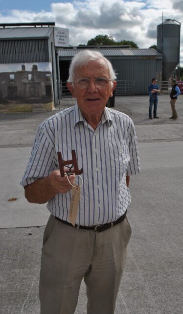 John Holohan displaying the Holohan family branding iron | Christy Cunniffe