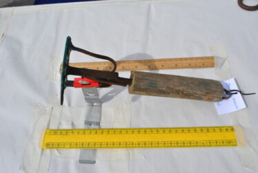 Side view showing the wooden handle or grip. | Christy Cunniffe