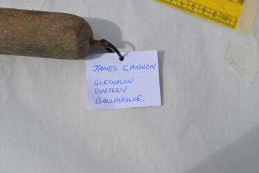 James Cannon branding iron with label | Christy Cunniffe