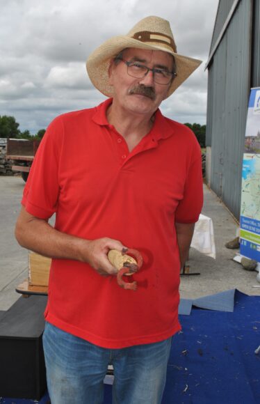 Tom Seale displaying his grandfathers branding iron | Christy Cunniffe