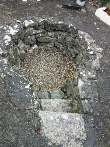 key hole shaped stone well