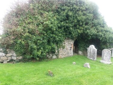 Medieval Church overgrown with ivy