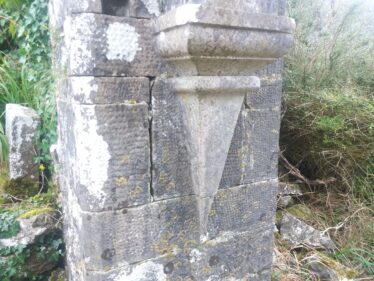 Deatail of corbelling at Ballinakill medieval arched doorway. Note sparrow-pecking detail of dressed stone