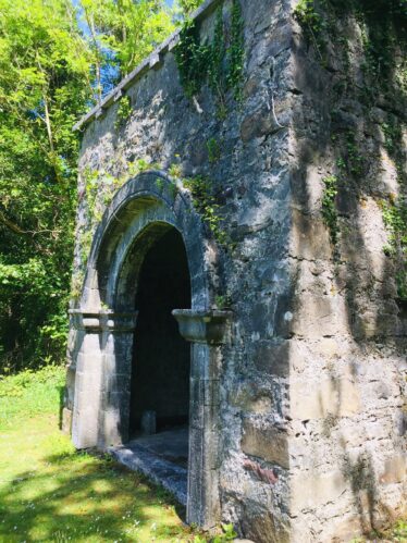 Arched doorway at Inchogoill, note the battered wall toward the base.