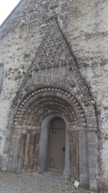 Romanesque doorway of seven orders, Clonfert Cathedral, splays towards the base, Each column is designed differentlywith zoomorphic and geometric designs. The innermost is a later addition of 15th Century. | B. Doherty, 2019