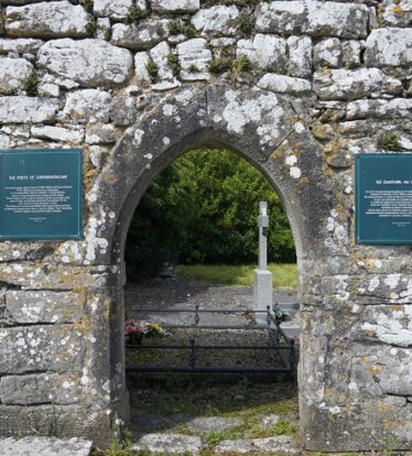 Pointed Arch doorway with signs on wither side