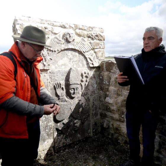 Christy Cunniffe and Dominic Delany at Bishop O'Kelly effigy, St. Kerrills | Hany Marzouk