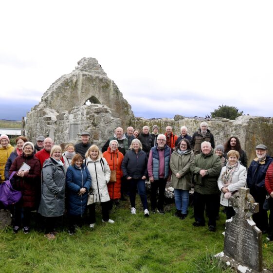 Group of people standing in front of the ruin of Kilboght Church | Hany Marzouk