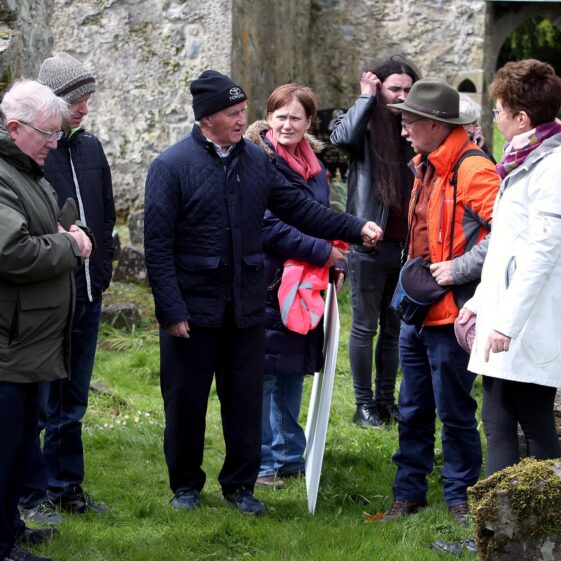 People standing within the ruins of Kilboght Church | Hany Marzouk