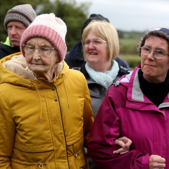 Ladies look on during tour of Kilboght Church and Graveyard | Hany Marzouk